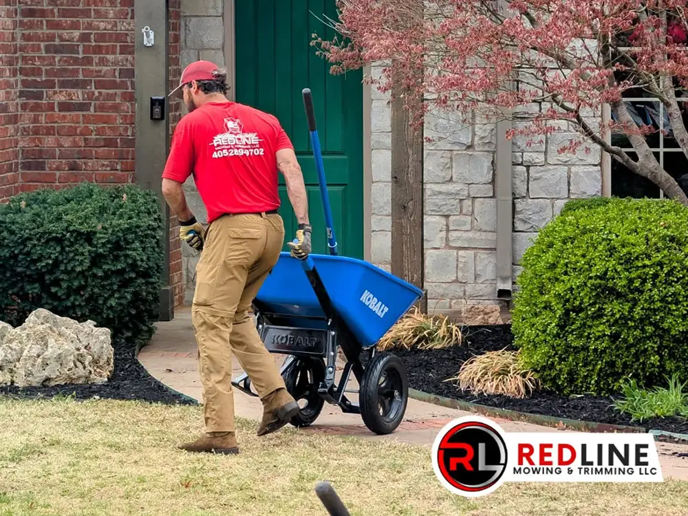 spring-fall-cleanup man picking up some fall debris